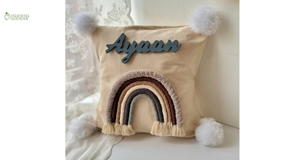 Personalized macrame name wall hanging with rainbow and pom-poms for baby nursery decor India