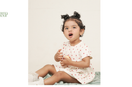 Baby sitting in apple print waffled organic cotton playsuit, GOTS certified clothing by Mamma & Amour