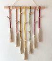 Classic macrame memory wall photo hanger with colorful cords and wooden clips for nursery decor