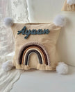 Personalized macrame rainbow cushion for baby nursery decor in India, featuring the custom name Ayaan