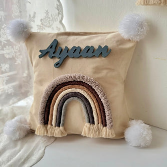 Personalized macrame rainbow cushion for baby nursery decor in India, featuring the custom name Ayaan