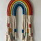 Personalised macrame rainbow name wall hanging with colourful cotton cord and natural fringe tassels – handcrafted nursery décor by Mamma & Amour