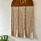 Mamma & Amour personalised wooden name wall hanging with cotton tassels and bead accents