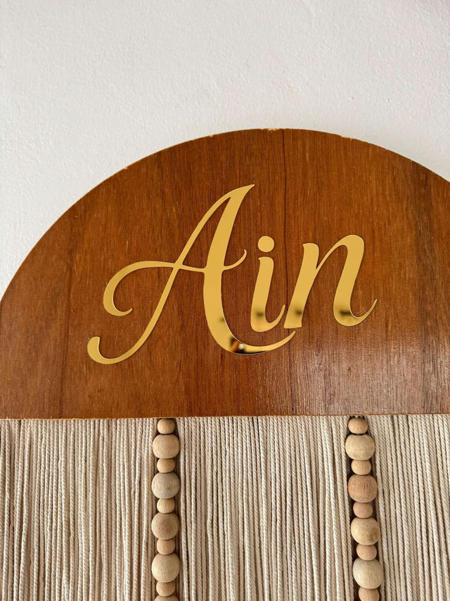 Mamma & Amour close up Ain personalised wooden baby name wall hanging india with gold script plaque